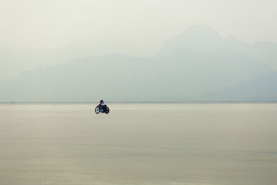 Man riding motorcycle at bonneville salt flats