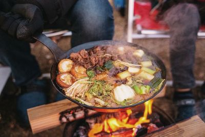 High angle view of meat cooking on barbecue grill