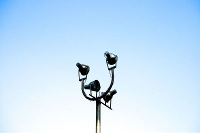 Low angle view of floodlight against clear sky