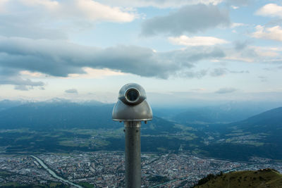 Scenic view of mountains against cloudy sky