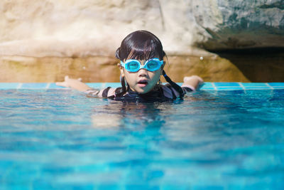 Portrait of boy in swimming pool