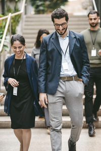 Portrait of smiling couple standing in city