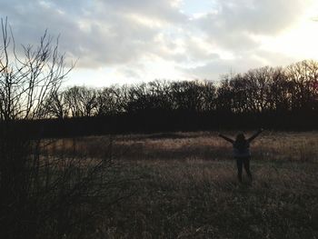 People walking on grassy field