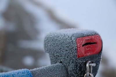 Close-up of snow over metal during winter