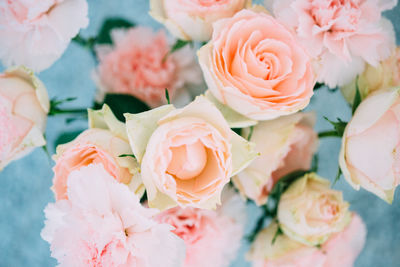 High angle view of roses and carnation flowers in vase