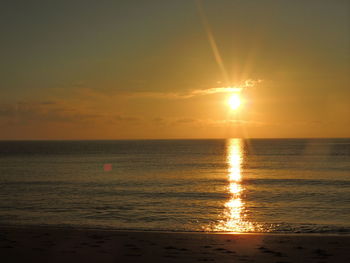 Scenic view of sea against sky at sunset