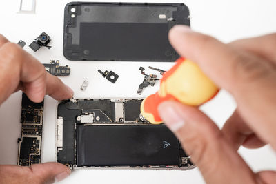 Cropped hand of person holding computer part