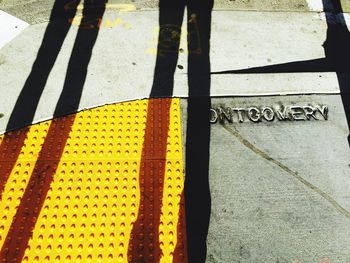 Low section of people walking on road