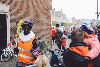 People on sidewalk in city