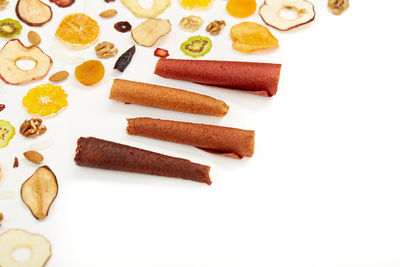 High angle view of cake on table against white background