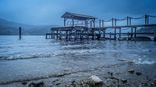 Pier on sea against sky