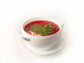 Close-up of soup in bowl against white background