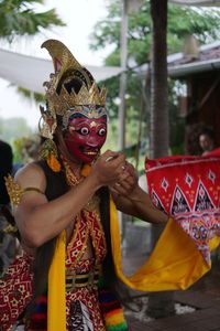 Midsection of person wearing mask