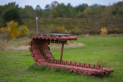 Close-up of metallic seat on field