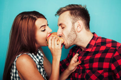 Young couple eating outdoors