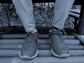 Low section of people sitting on staircase