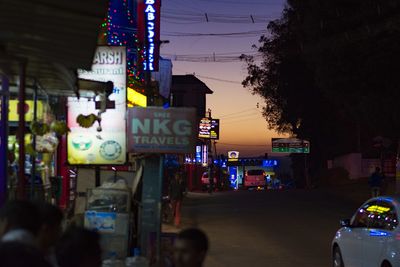 Illuminated road sign at night