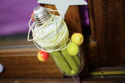 Close-up of light bulb on table