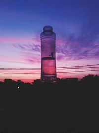 Low angle view of built structure at sunset