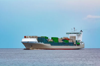 Ship in sea against sky