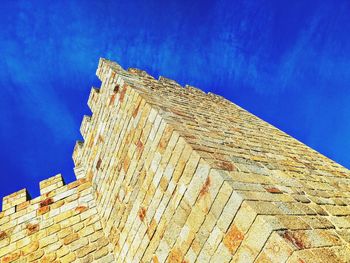 Low angle view of building against blue sky