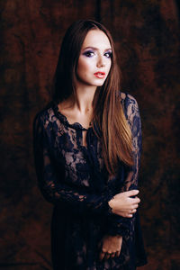 Portrait of young woman in studio