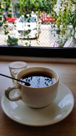 Close-up of coffee cup on table