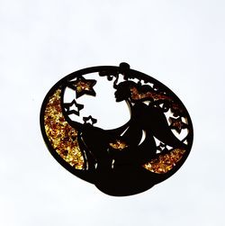Low angle view of clock on wall