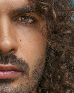 Close-up portrait of man with curly hair