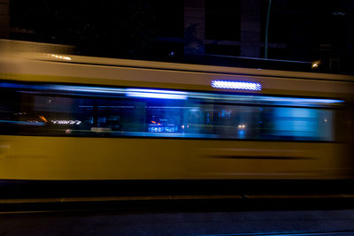 Blurred motion of train at railroad station