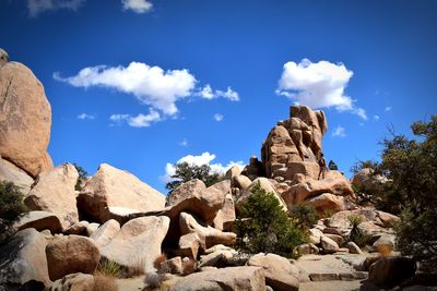 Low angle view of rock formation against sky