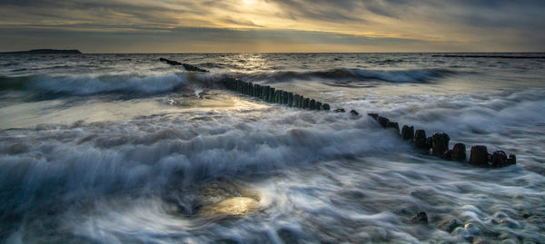 Scenic view of sea against sky during sunset