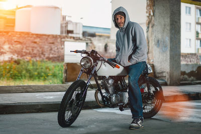 Portrait of man riding bicycle on street