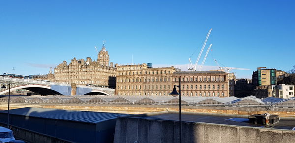 View of buildings against blue sky