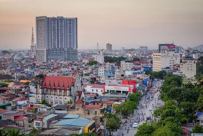 High angle view of buildings against sky during sunset