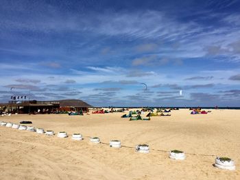 Scenic view of beach against blue sky