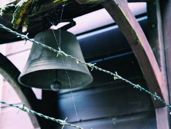 Close-up of barbed wires against bell