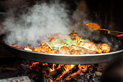 Close-up of meat cooking on barbecue grill