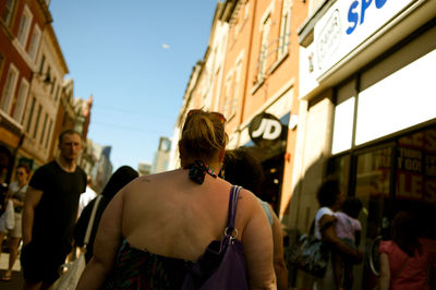 Rear view of woman walking on street