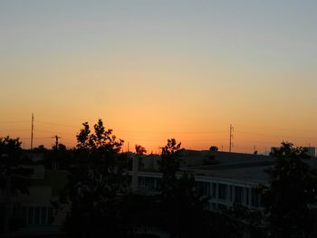 Silhouette of house at sunset