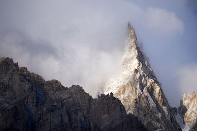 Low angle view of mountain against sky. karakoram and himalayas maintain range.