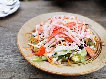 Close-up of chopped fruits in plate on table