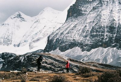 Man standing on snowcapped mountain