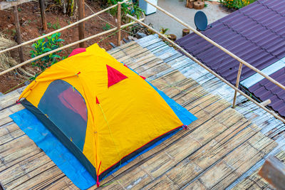 High angle view of yellow umbrella on footpath