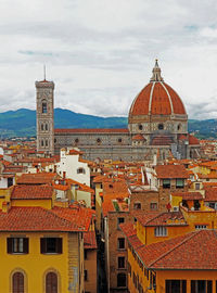 High angle view of buildings in city against sky