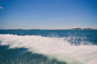 Scenic view of sea against clear blue sky