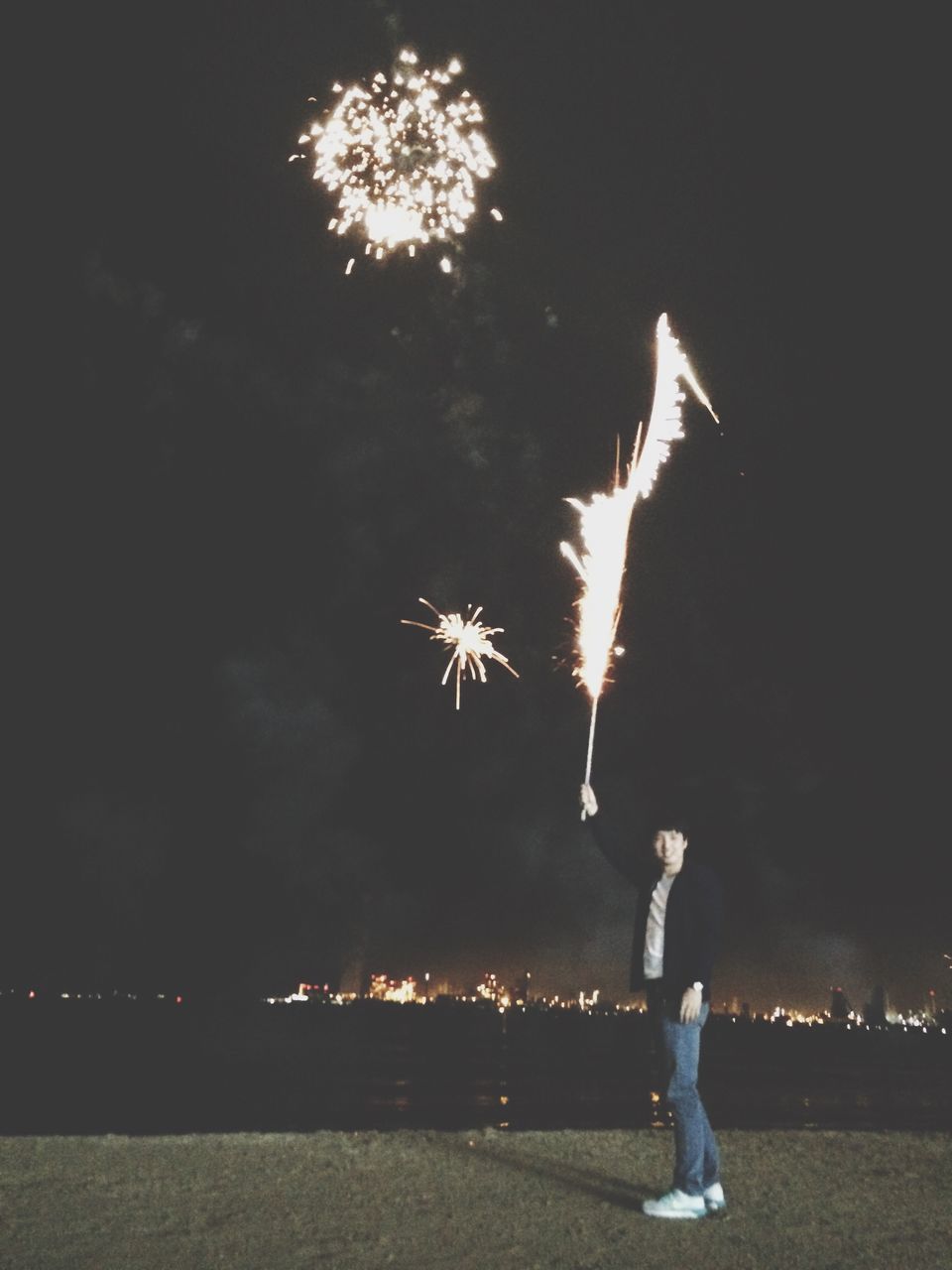 night, illuminated, celebration, motion, long exposure, firework display, tree, sky, arts culture and entertainment, exploding, event, firework - man made object, leisure activity, lifestyles, outdoors, standing, glowing, sparks