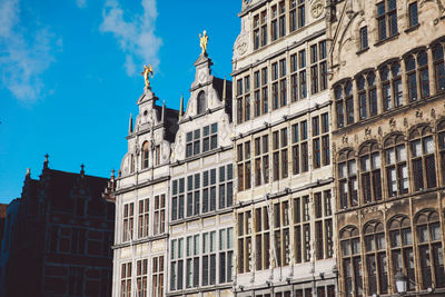 Buildings against sky on sunny day