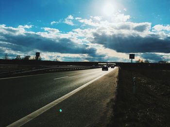 Road against cloudy sky