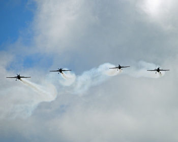 Low angle view of airplane flying in sky